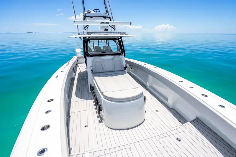 Slide: The Image of 2024 Freeman 42 boat on calm turquoise water, featuring spacious deck and modern design. - 32