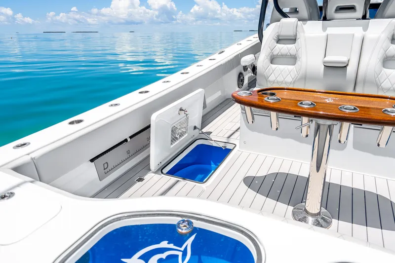 Slide: The Image of 2024 Freeman 42 boat interior with luxury seating and fishing amenities on calm water. - 41