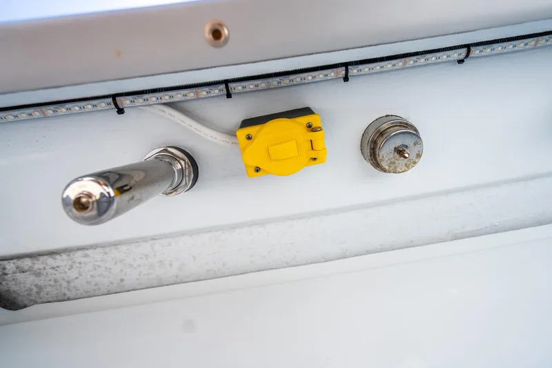 Slide: The Image of Close-up of Freeman 42 boat components, featuring a yellow switch and LED strip, 2024 model. - 54
