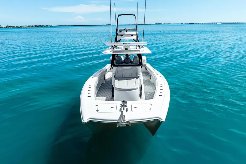 Slide: The Image of 2024 Freeman 42 boat on clear blue water, showcasing sleek design and modern features. - 8