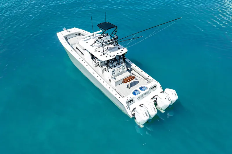 Slide: The Image of 2024 Freeman 42 boat on clear blue water, aerial view. - 9