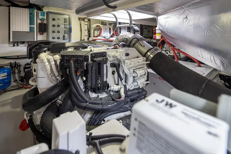 Slide: The Image of Engine room of 2018 Riviera 4800 Sport Yacht, showcasing complex machinery and components. - 24