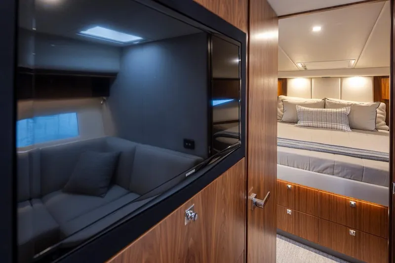 Slide: The Image of Luxurious interior of 2018 Riviera 4800 Sport Yacht with cozy bedroom and modern amenities. - 39