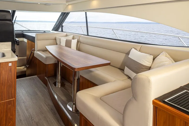 Slide: The Image of Luxurious interior of 2018 Riviera 4800 Sport Yacht with elegant seating and ocean view. - 45