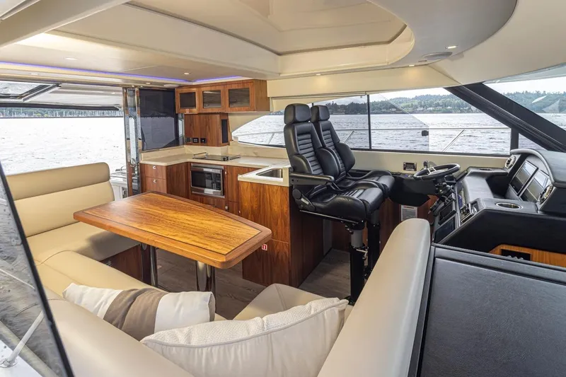 Slide: The Image of Luxurious interior of 2018 Riviera 4800 Sport Yacht with modern kitchen and helm. - 54