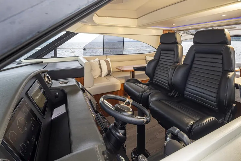 Slide: The Image of Interior of 2018 Riviera 4800 Sport Yacht with luxurious seating and ocean view. - 55