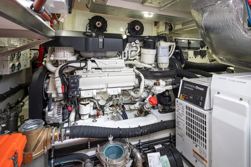 Slide: The Image of Engine room of 2018 Riviera 4800 Sport Yacht with Cummins Onan generator and Volvo components. - 56