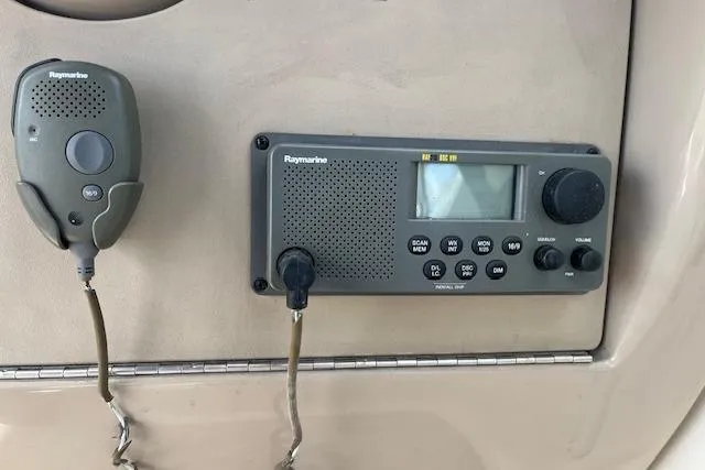 Slide: The Image of Raymarine marine radio system on 2003 Sea Ray 260 Sundancer boat dashboard. - 14