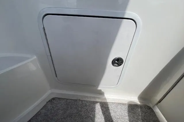 Slide: The Image of Storage compartment on a 2003 Sea Ray 260 Sundancer boat interior. - 19