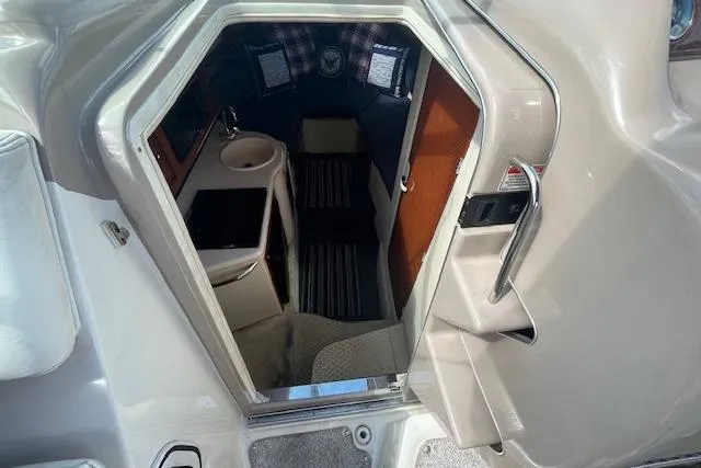 Slide: The Image of Interior cabin view of 2003 Sea Ray 260 Sundancer boat, featuring compact amenities. - 24