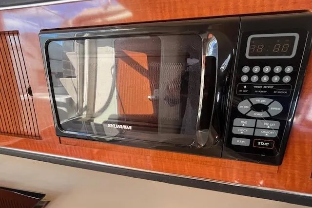 Slide: The Image of Sylvania microwave in 2003 Sea Ray 260 Sundancer boat kitchen interior. - 32