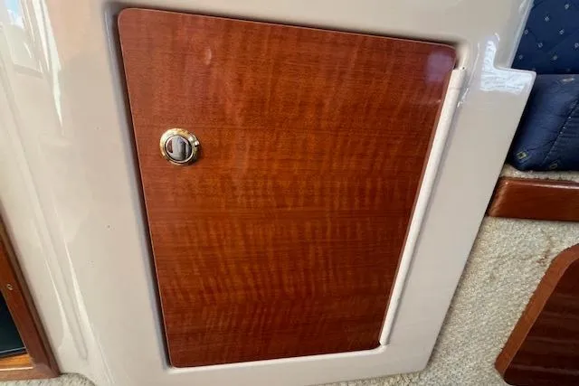 Slide: The Image of Wooden cabinet door on 2003 Sea Ray 260 Sundancer boat interior. - 36