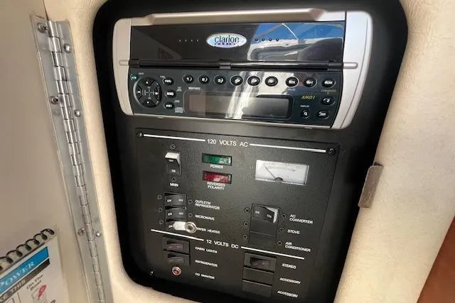 Slide: The Image of Control panel of a 2003 Sea Ray 260 Sundancer boat with Clarion audio system. - 39