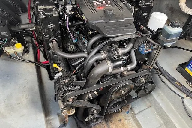 Slide: The Image of Engine of 2003 Sea Ray 260 Sundancer boat, showcasing mechanical components and layout. - 45