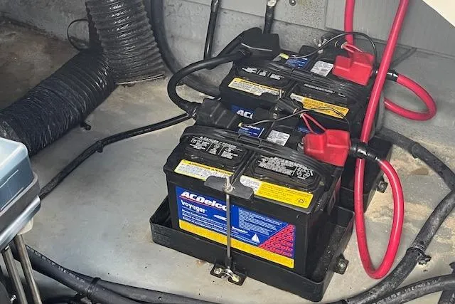 Slide: The Image of Batteries in a 2003 Sea Ray 260 Sundancer boat engine compartment. - 46