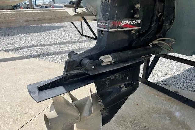 Slide: The Image of Outboard motor of 2003 Sea Ray 260 Sundancer with Mercury branding, displayed on a trailer. - 48