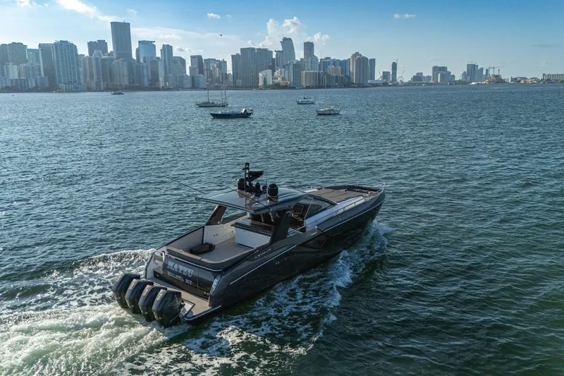 Slide: The Image of 2023 Azimut Verve 47 yacht cruising near city skyline on a sunny day. - 10