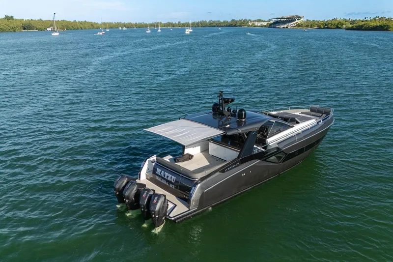 Slide: The Image of 2023 Azimut Verve 47 luxury yacht cruising on a serene blue waterway. - 11