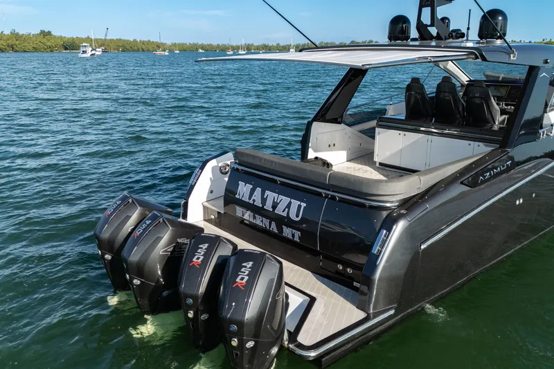 Slide: The Image of 2023 Azimut Verve 47 luxury yacht with powerful outboard engines on the water. - 13