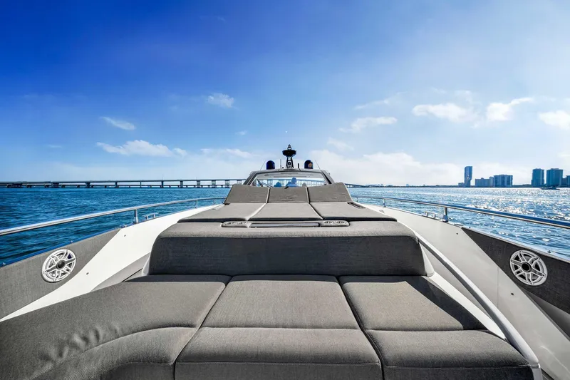 Slide: The Image of 2023 Azimut Verve 47 yacht with luxurious sunbathing area, cruising on open water. - 20