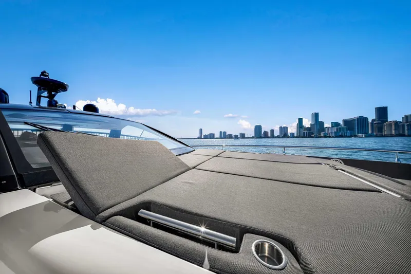 Slide: The Image of 2023 Azimut Verve 47 yacht with city skyline in the background. - 21