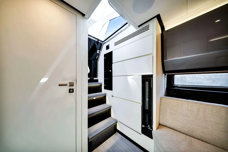 Slide: The Image of Interior of 2023 Azimut Verve 47 yacht, featuring modern design and sleek staircase. - 34
