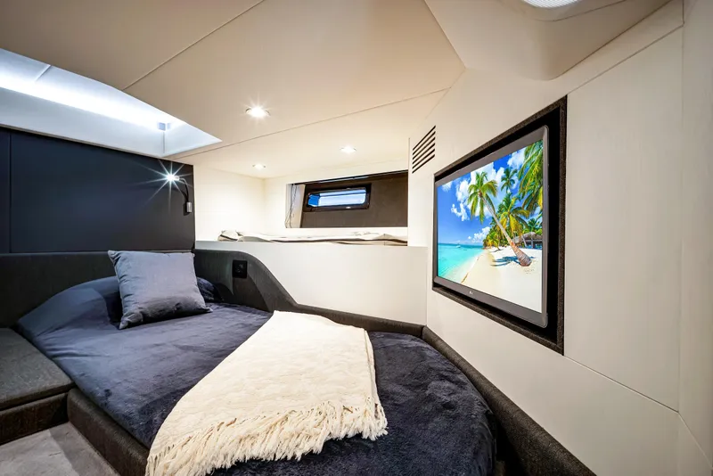 Slide: The Image of Luxurious cabin interior of 2023 Azimut Verve 47 yacht with cozy bed and TV. - 38