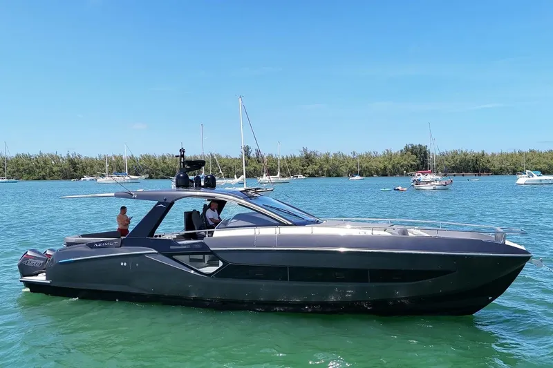 Slide: The Image of 2023 Azimut Verve 47 yacht cruising on a sunny day, surrounded by other boats. - 4