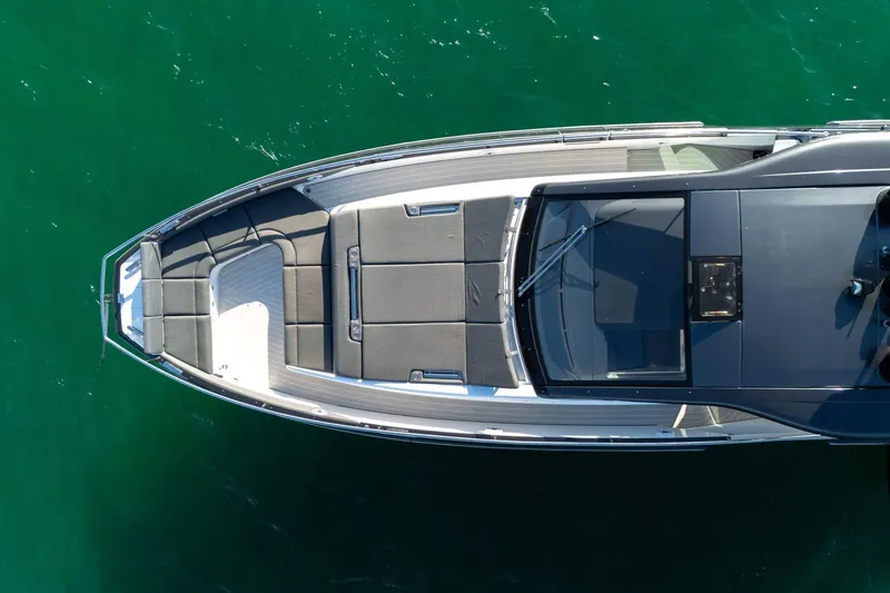 Slide: The Image of Top view of 2023 Azimut Verve 47 yacht on clear green water. - 7