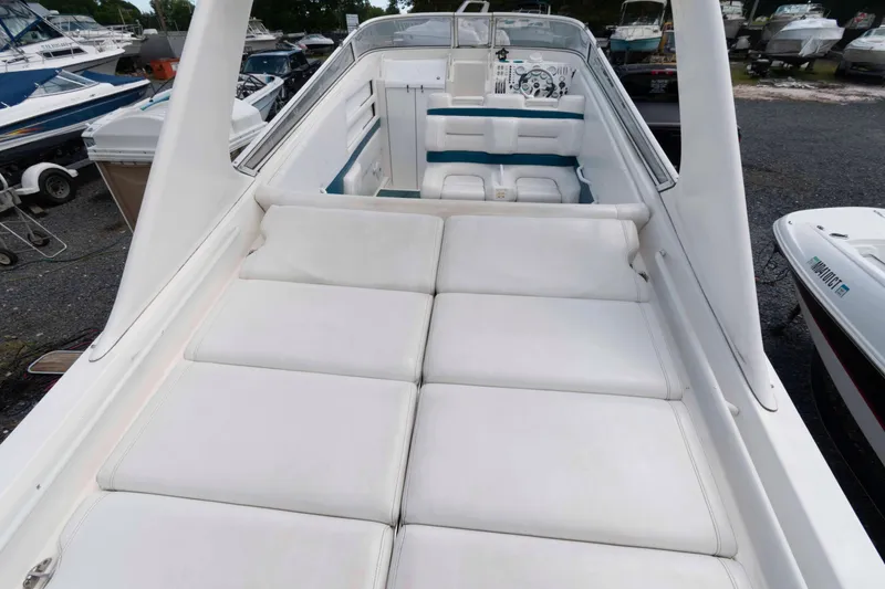 Slide: The Image of 1999 Fountain 38 Lightning boat with spacious white seating and sleek design. - 2