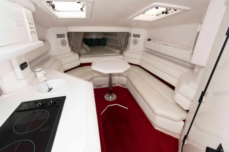 Slide: The Image of Luxurious interior of 1999 Fountain 38 Lightning boat with white seating and red carpet. - 8