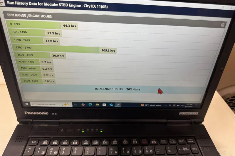 Slide: The Image of Panasonic laptop displaying engine hours for 2011 Sea Ray 240 Sundeck. Total: 202.4 hours. - 14