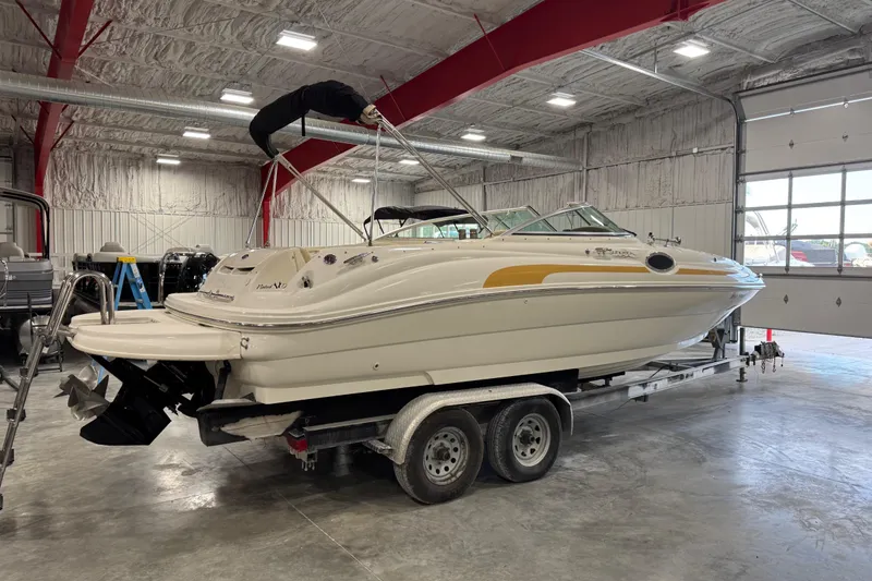 Slide: The Image of 2001 Sea Ray 240 Sundeck boat on trailer in indoor storage facility. - 4