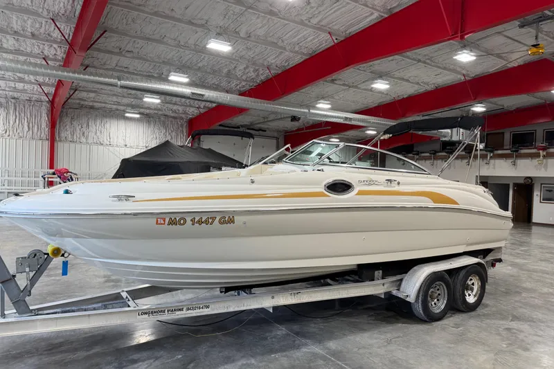 Slide: The Image of 2001 Sea Ray 240 Sundeck boat on trailer in indoor storage facility. - 5