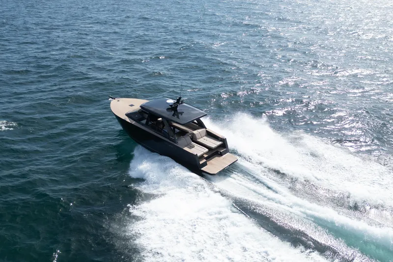 Slide: The Image of 2025 Colnago C38 OPEN yacht cruising on open water, showcasing sleek design. - 12