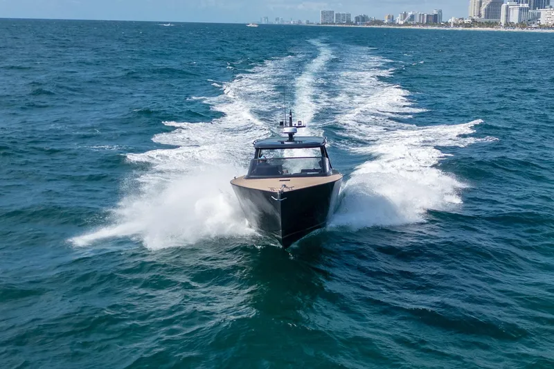 Slide: The Image of Luxury Colnago C38 OPEN yacht cruising on ocean, 2025 model, city skyline in background. - 15