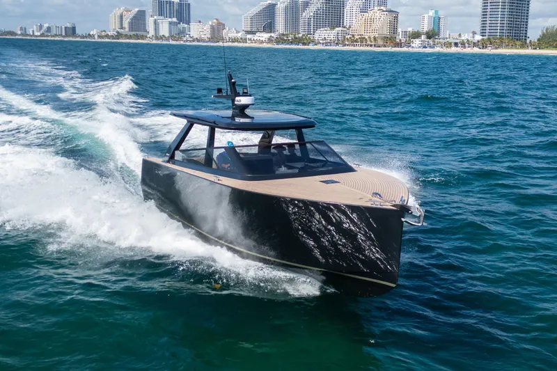 Slide: The Image of 2025 Colnago C38 OPEN yacht cruising near city skyline on blue ocean waters. - 19