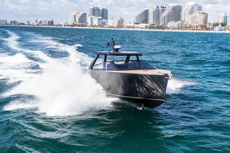 Slide: The Image of 2025 Colnago C38 OPEN yacht cruising near city skyline on a sunny day. - 21