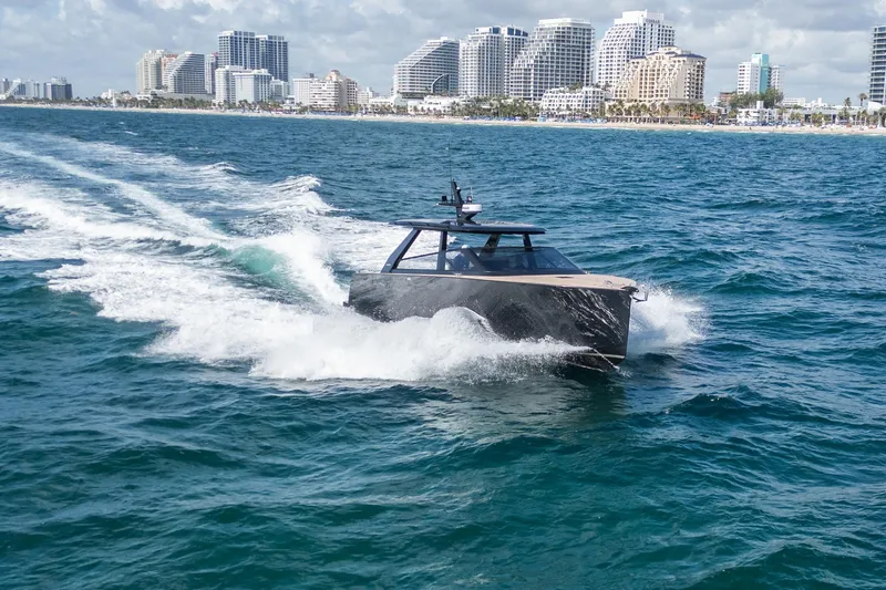 Slide: The Image of 2025 Colnago C38 OPEN yacht cruising near a city skyline on a sunny day. - 22