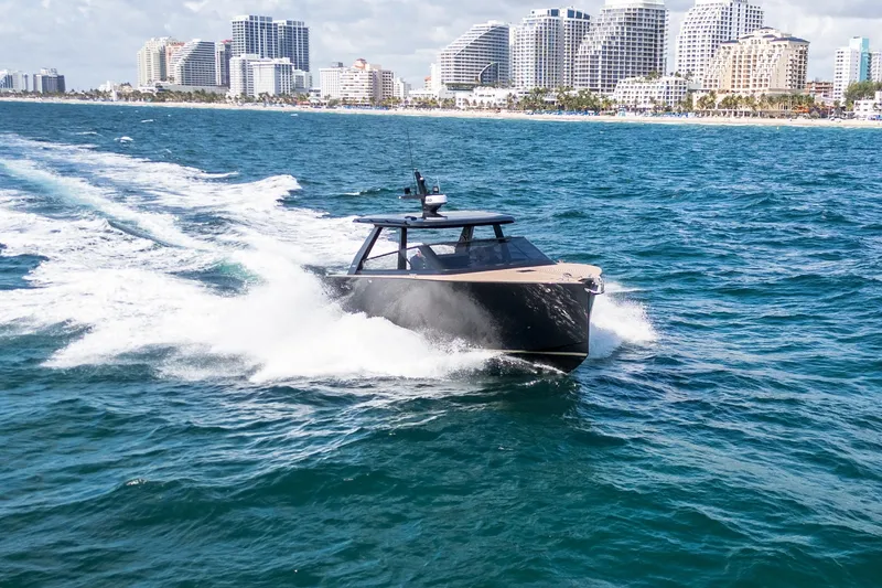 Slide: The Image of 2025 Colnago C38 OPEN yacht cruising near a city skyline on a sunny day. - 24