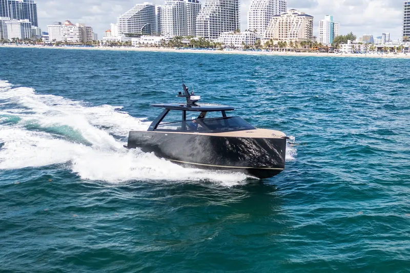 Slide: The Image of 2025 Colnago C38 OPEN yacht cruising near a city skyline on a sunny day. - 25