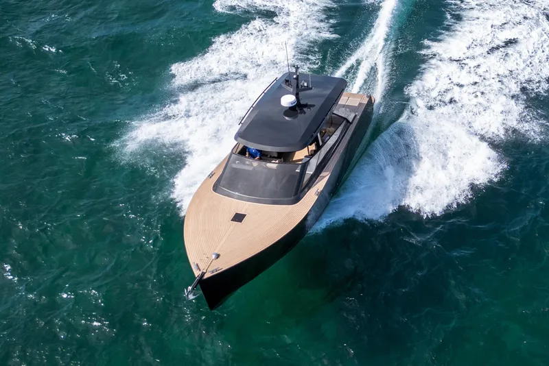 Slide: The Image of 2025 Colnago C38 OPEN yacht cruising on vibrant blue ocean waters. - 28