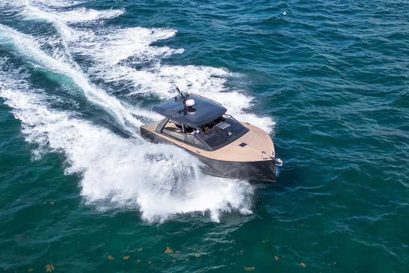 Slide: The Image of 2025 Colnago C38 OPEN yacht cruising on open water, creating a dynamic wake. - 29