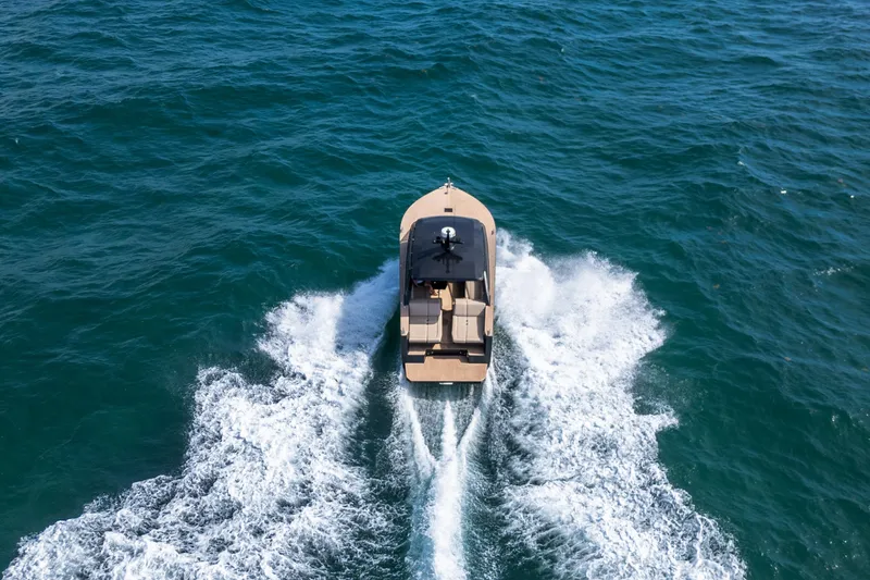 Slide: The Image of Aerial view of 2025 Colnago C38 OPEN boat cruising on the ocean. - 30