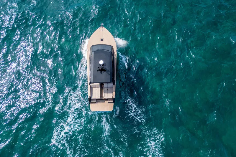 Slide: The Image of Aerial view of 2025 Colnago C38 OPEN yacht cruising on turquoise waters. - 4