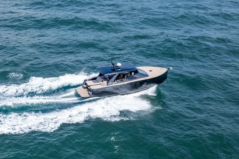 Slide: The Image of 2025 Colnago C38 OPEN yacht cruising on open sea, creating white wake trails. - 44