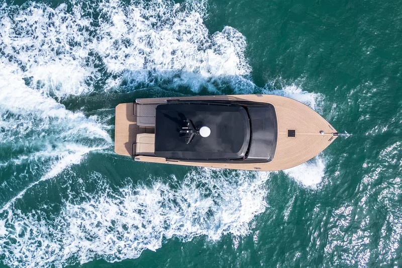 Slide: The Image of Aerial view of 2025 Colnago C38 OPEN yacht cruising on turquoise water. - 45