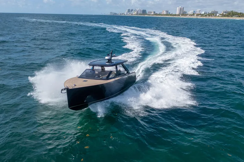 Slide: The Image of 2025 Colnago C38 OPEN yacht cruising on ocean near city skyline. - 5