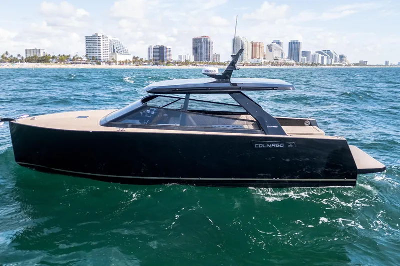 Slide: The Image of 2025 Colnago C38 OPEN yacht cruising near a city skyline on a sunny day. - 50