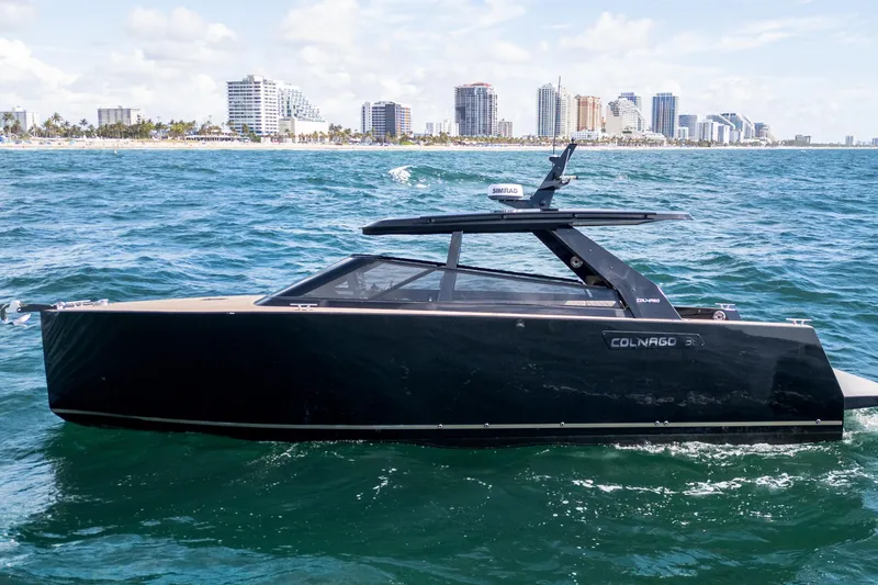 Slide: The Image of 2025 Colnago C38 OPEN yacht cruising near a city skyline on a sunny day. - 51